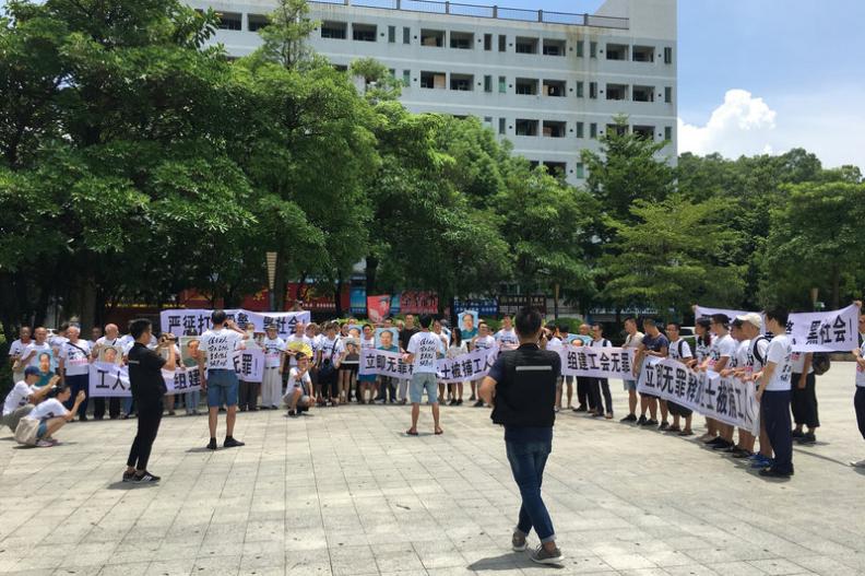 Chinese workers protest outside