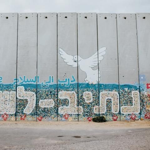 barrier wall with peace dove grafiti