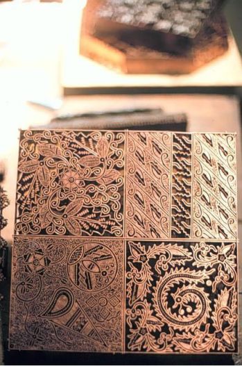 A photo of a box engraved in Southeast Asian styles