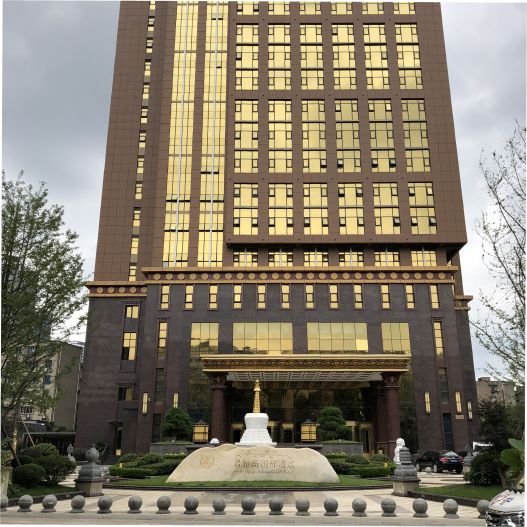 A skyscraper in Tibet blends elements of traditional architecture with contemporary as the building's bronze tinted windows glow in the sunlight