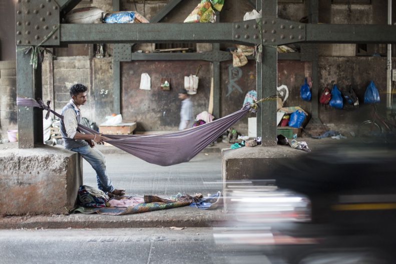 Man and cot in India