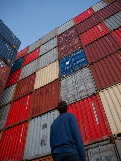 Stack of shipping containers at port for international trade