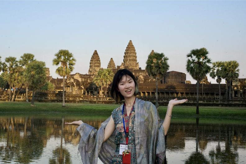 Cornell student in front of Angkor Wat.