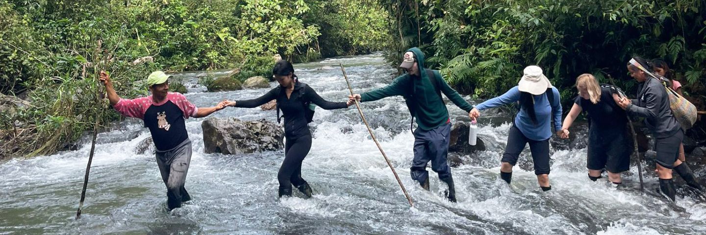 Group of Laidlaw scholars crossing river, summer 2025