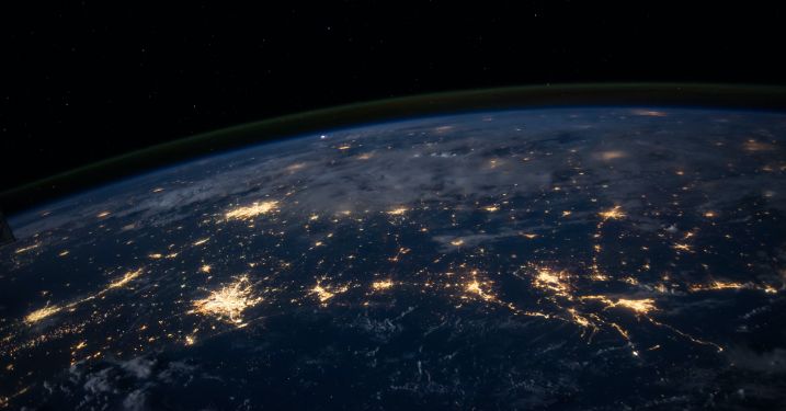 top half of earth at night with lights 