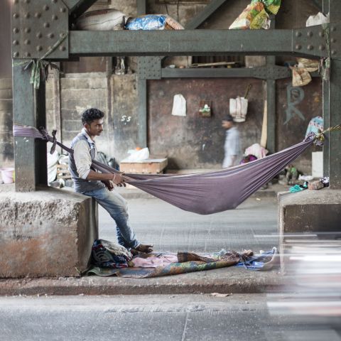 Man and cot in India