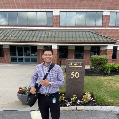 Luis Tamayo stands in front of his office