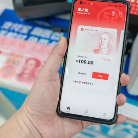 Chinese customer using digital currency, the digital yuan on mobile phone when shopping in the mall (Chongqing, China-May 8th 2022)