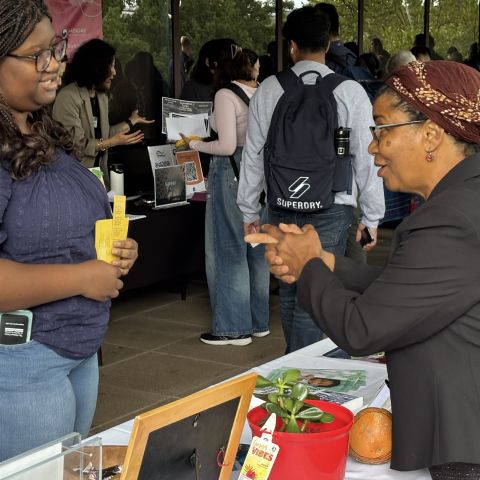 IAD program manager and student chatting
