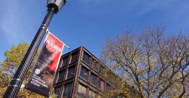 Global Research banner outside Uris Hall
